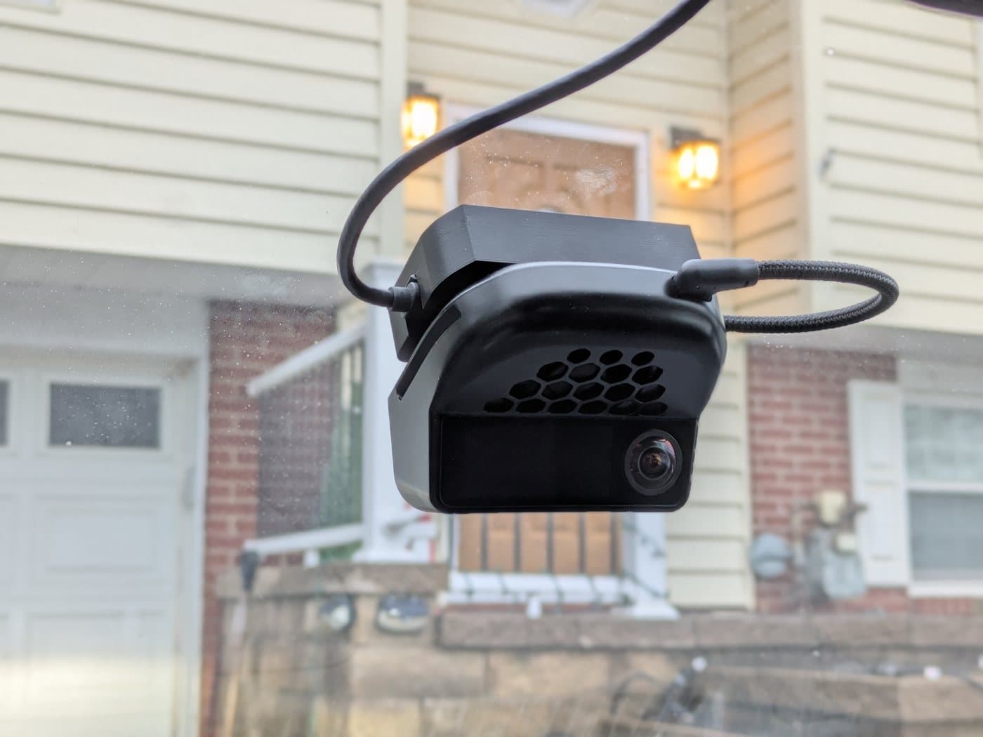 comma four on a printed quick disconnect mount held up outdoors