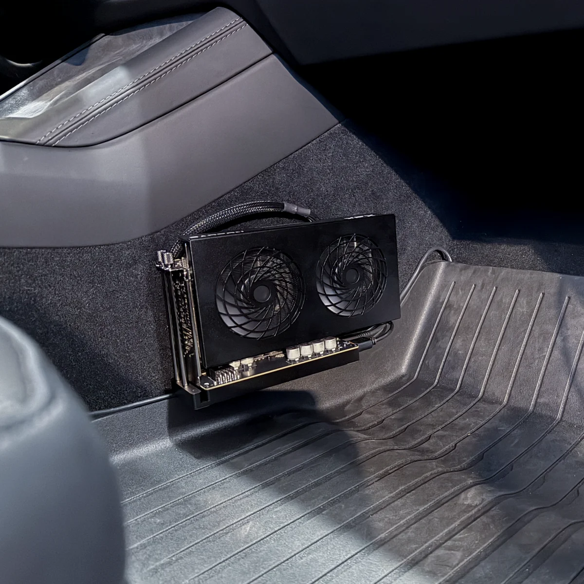Chestnut graphics hardware mounted in a passenger footwell